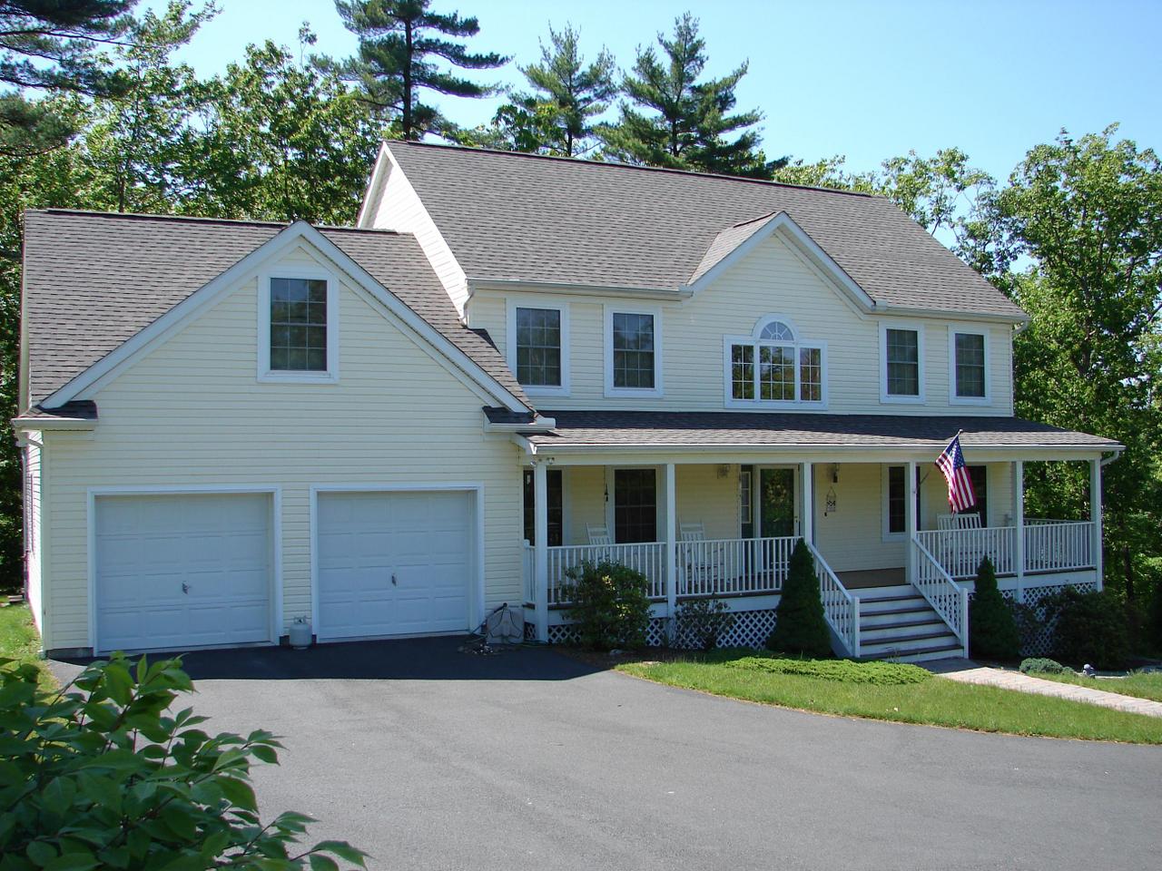 102 Kelly Road Stroudsburg, PA 18360 - Photo 1 of 13 a front view of a house with a yard and garage