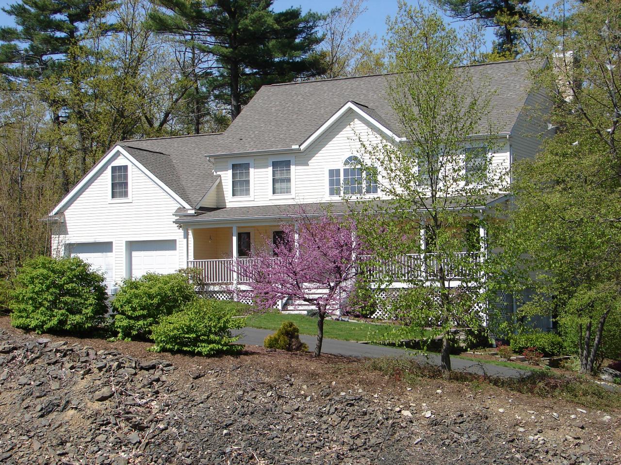 102 Kelly Road Stroudsburg, PA 18360 - Photo 7 of 13 a front view of a house with garden