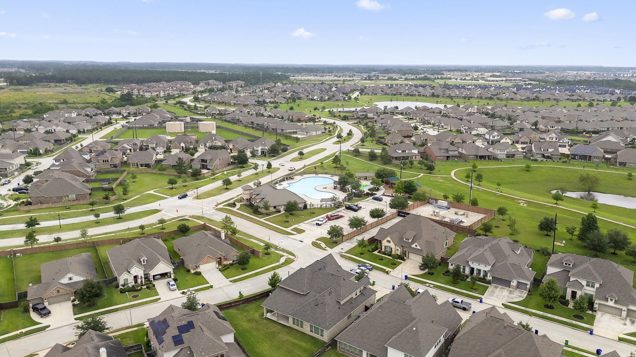 7502 Windsor Park Court Spring, TX 77379 - Photo 45 of 50 Laurel Park living comes into view here, with the community pool, clubhouse, ponds, and walking trails woven into the neighborhood setting just beyond the surrounding streets.