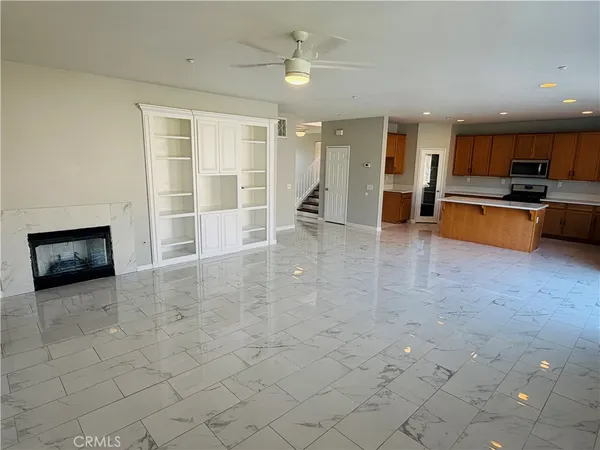a view of an house with backyard and sitting area