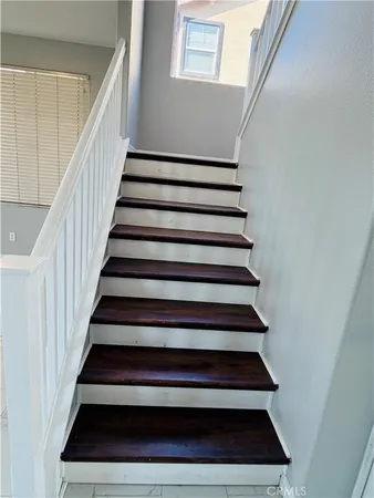 a view of a room with a ceiling fan and a window