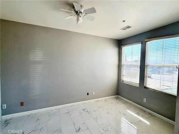 a kitchen with stainless steel appliances a stove a sink a microwave a refrigerator and cabinets