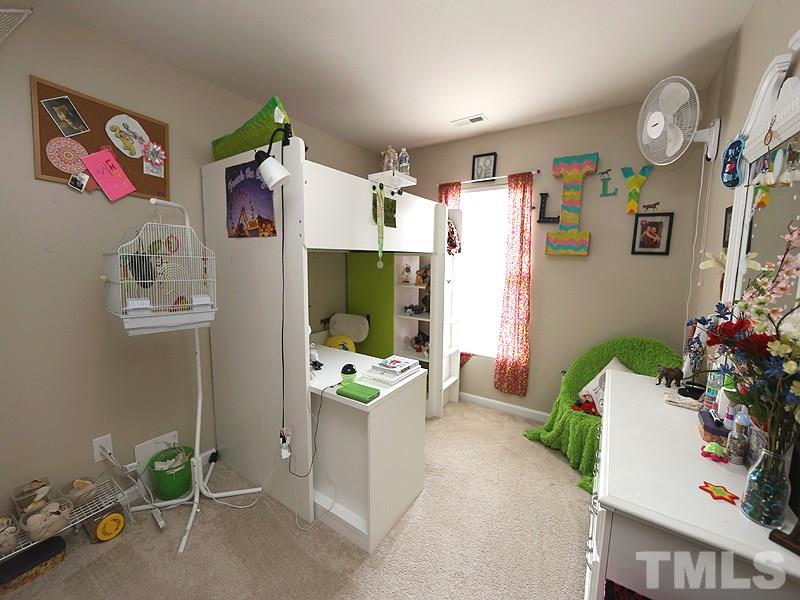 8208 Clasara Circle Raleigh, NC 27613 - Photo 11 of 19 a living room with furniture and a potted plant