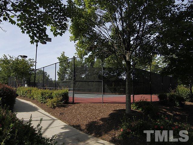 8208 Clasara Circle Raleigh, NC 27613 - Photo 17 of 19 a backyard of a house with lots of green space