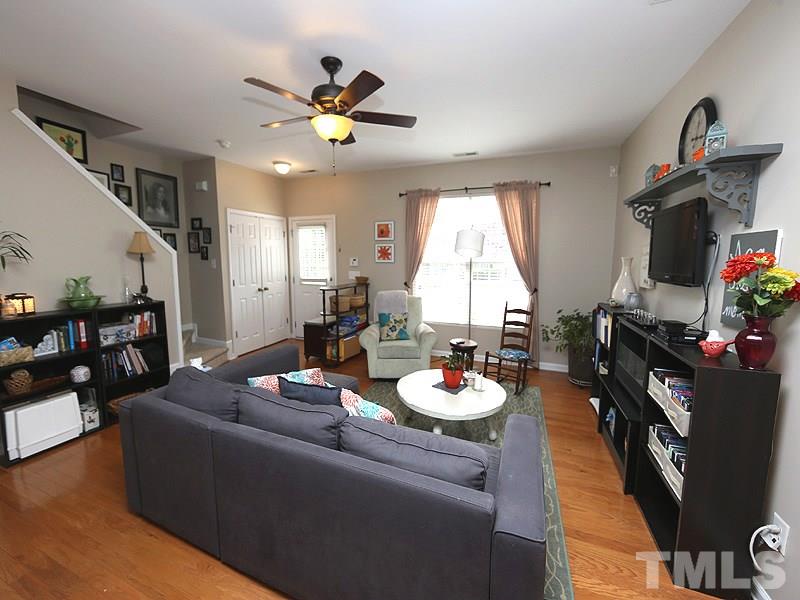 8208 Clasara Circle Raleigh, NC 27613 - Photo 4 of 19 a living room with furniture and a flat screen tv