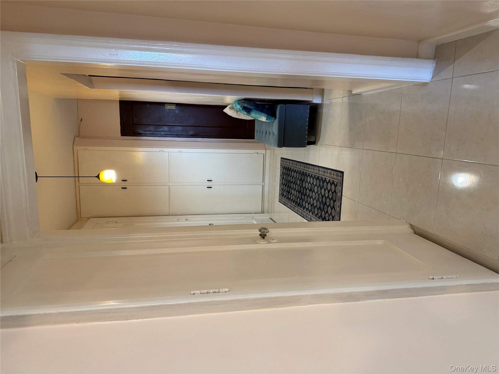 2922 Barnes Avenue, Unit 6D Bronx, NY 10467 - Photo 12 of 19 a bathroom with a sink and a mirror