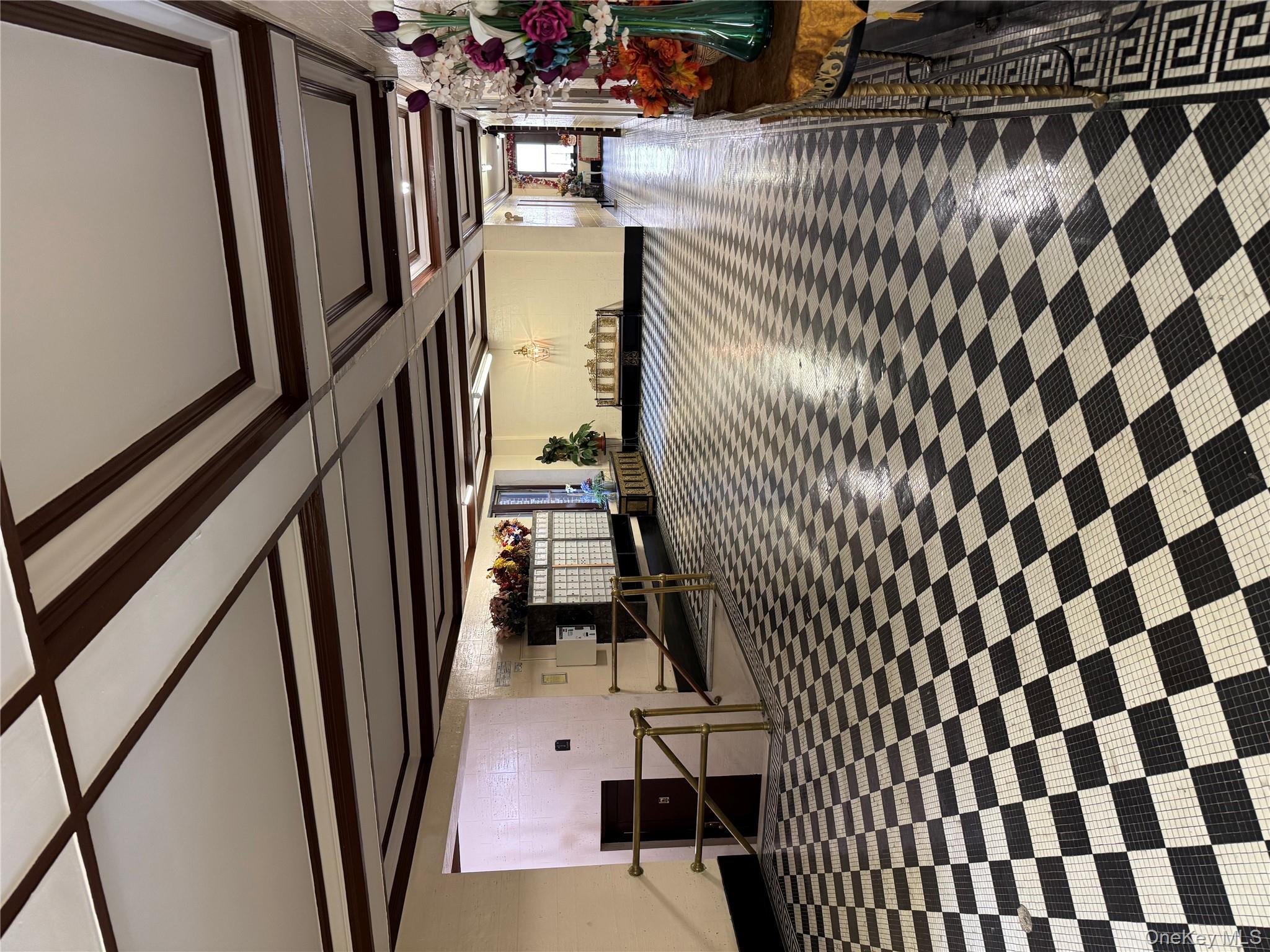 2922 Barnes Avenue, Unit 6D Bronx, NY 10467 - Photo 14 of 19 a hallway with a black white checkered floor