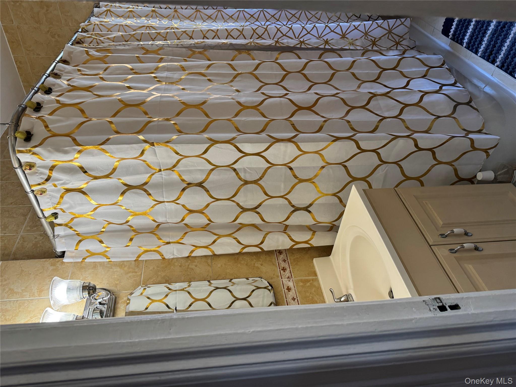 2922 Barnes Avenue, Unit 6D Bronx, NY 10467 - Photo 8 of 19 a bathroom with a sink and a mirror