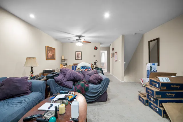 a bed room with furniture and a chandelier