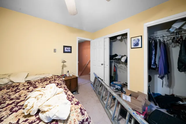 a bed room with a bed and a television