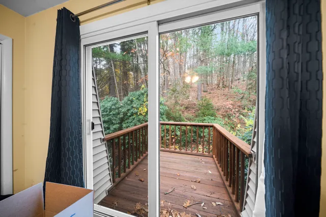 a view of a balcony with wooden floor