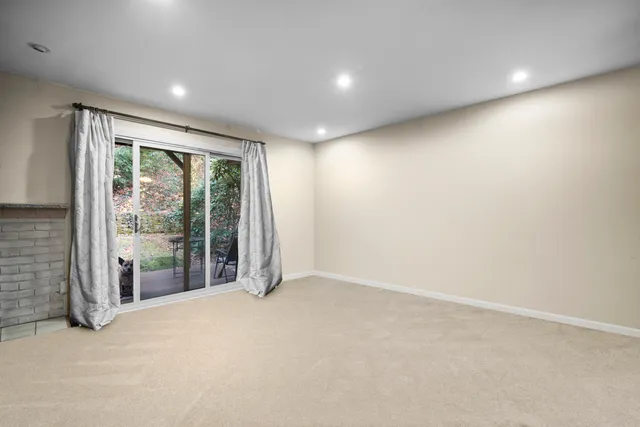 a view of an empty room with a balcony