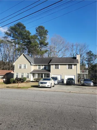 a front view of a house with a yard