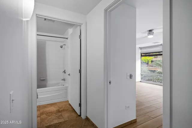 a bathroom with a bathtub and shower