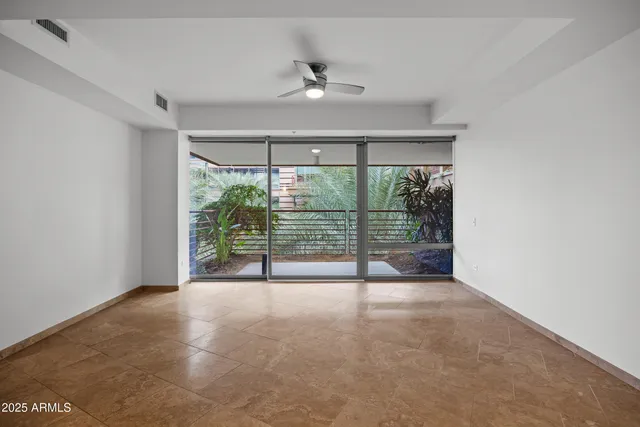 a view of an empty room with a sliding door