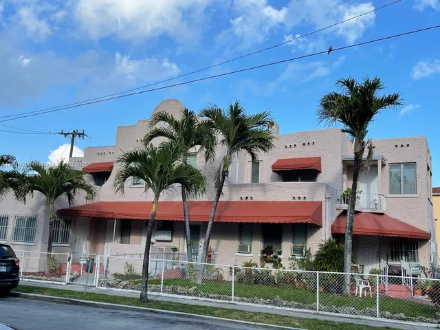 a view of multiple houses with a yard