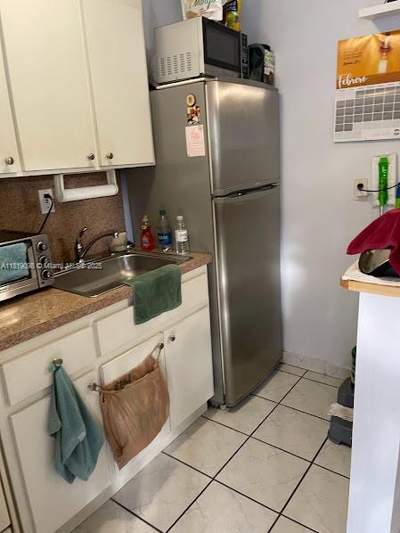829 Southwest 19th Avenue Miami, FL 33135 - Photo 13 of 30 a kitchen with stainless steel appliances granite countertop a refrigerator and a stove