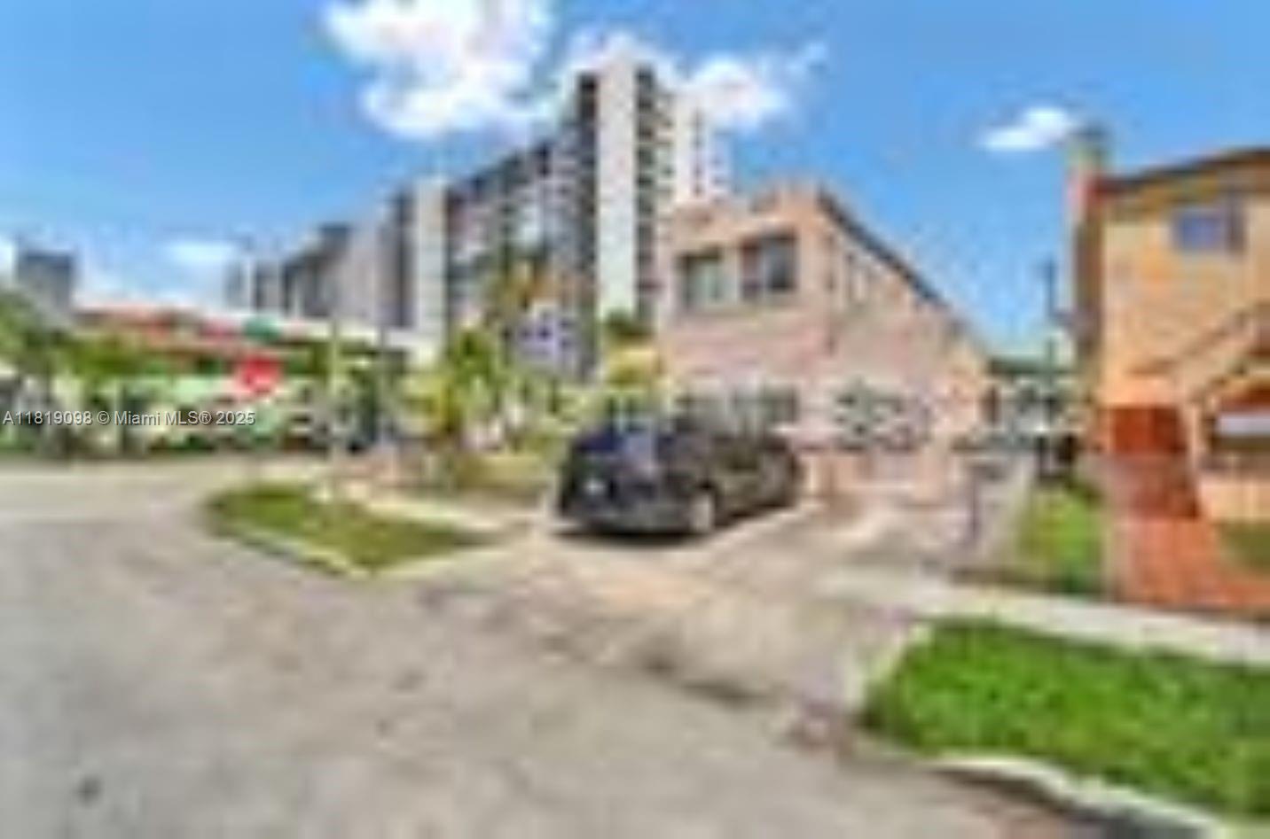 829 Southwest 19th Avenue Miami, FL 33135 - Photo 4 of 30 a view of street with tall buildings