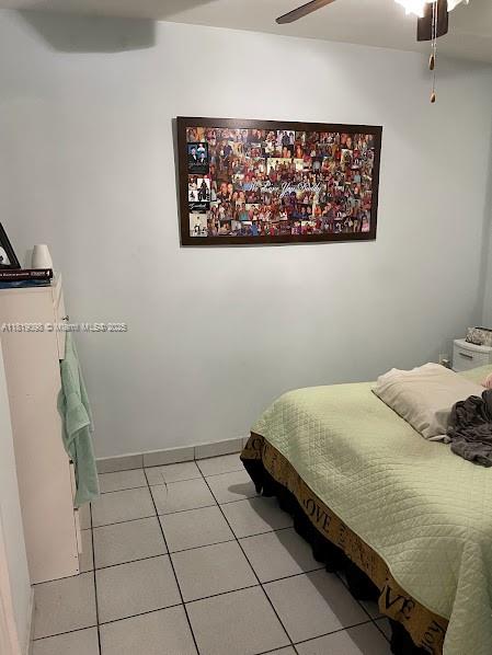 829 Southwest 19th Avenue Miami, FL 33135 - Photo 10 of 30 a bedroom with a bed and the wall painting