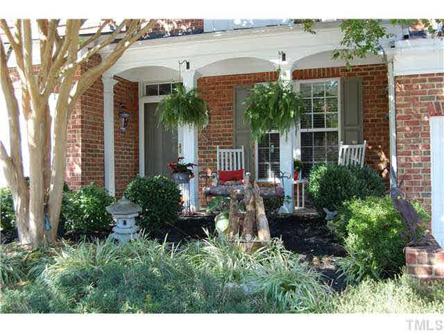 Closer view of front porch with brick front, columns, & every bedroom has a full bath! Exterior Front