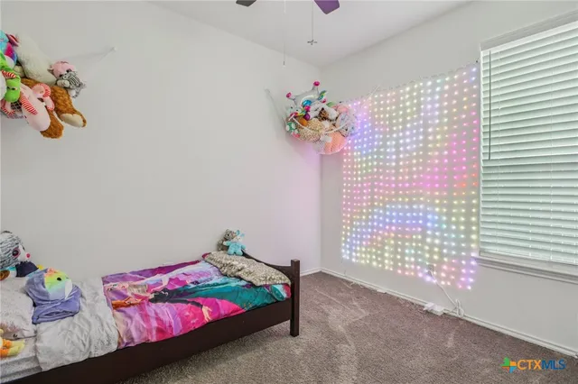 a bedroom with a bed and a table