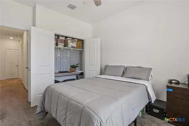 a view of a patio with table and chairs a barbeque with wooden floor and fence