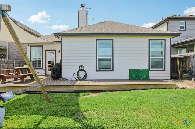 a view of a patio with couches chairs and a table