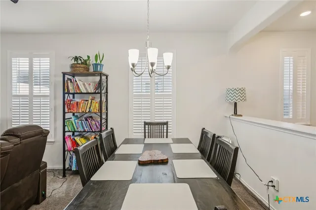 a view of a dining room with furniture