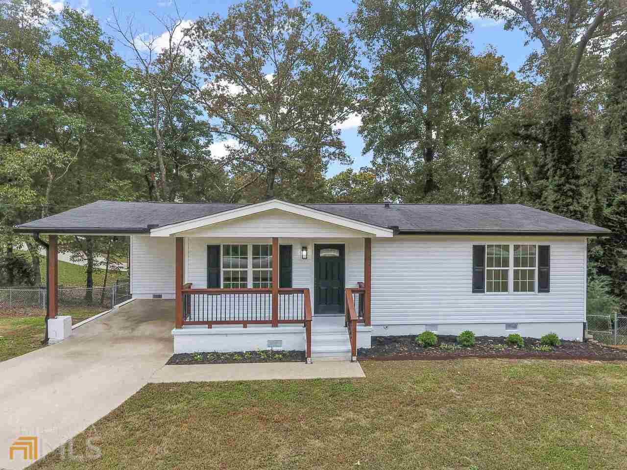 3526 Lakeland Road Gainesville, GA 30506 - Photo 1 of 1 a view of a house with a yard and large tree