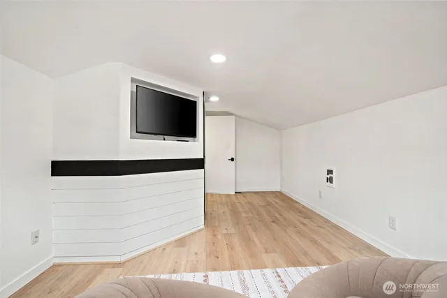 a living room with a flat screen tv