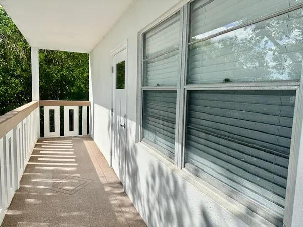 a view of a balcony with a porch