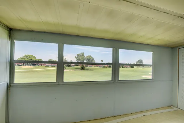 a kitchen with stainless steel appliances granite countertop white cabinets sink and granite counter tops