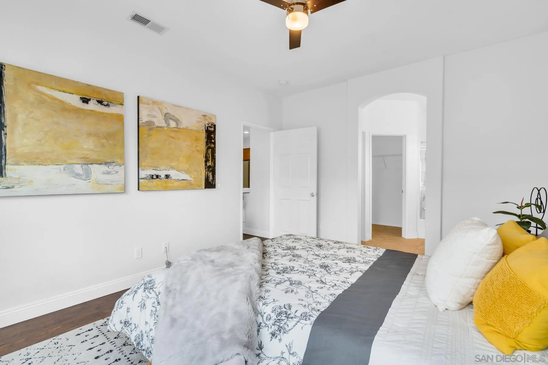 649 Sumner Way, Unit 6 Oceanside, CA 92058 - Photo 12 of 30 a bedroom with a bed and painting on the wall