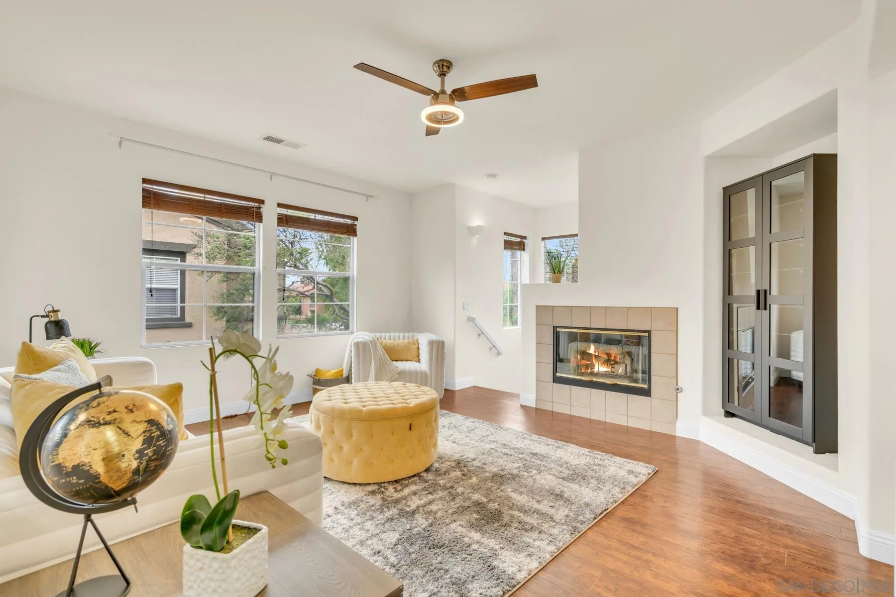 649 Sumner Way, Unit 6 Oceanside, CA 92058 - Photo 3 of 30 a living room with furniture a window and a fireplace