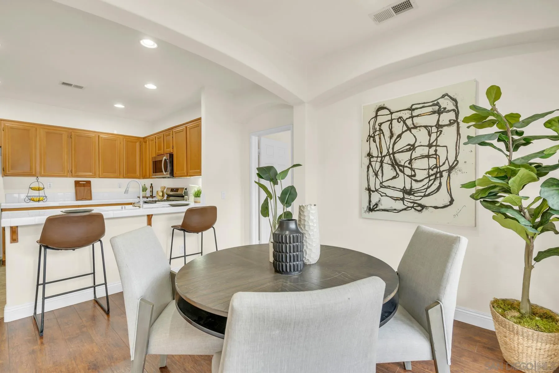 649 Sumner Way, Unit 6 Oceanside, CA 92058 - Photo 7 of 30 a dining room with furniture and wooden floor