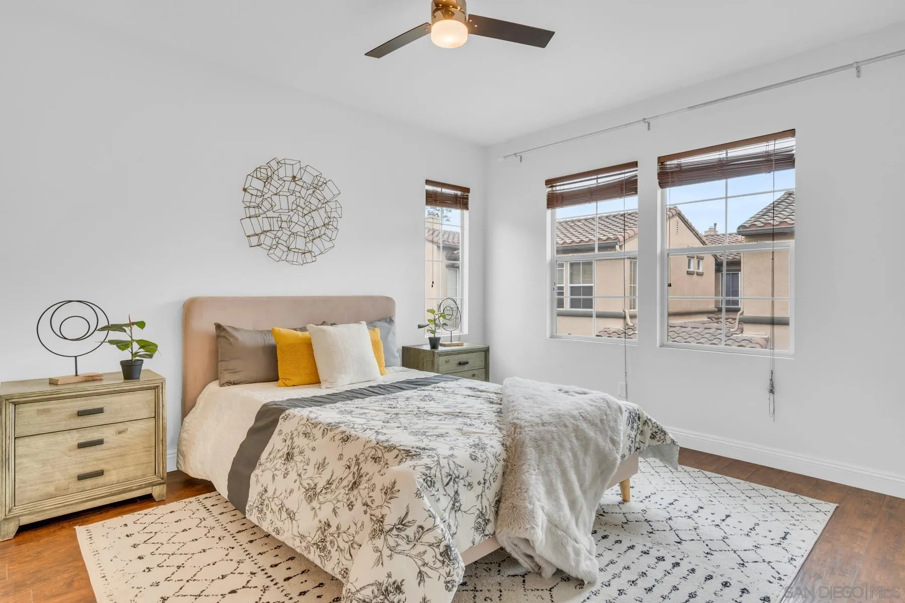 649 Sumner Way, Unit 6 Oceanside, CA 92058 - Photo 10 of 30 a bed room with a bed and a chandelier