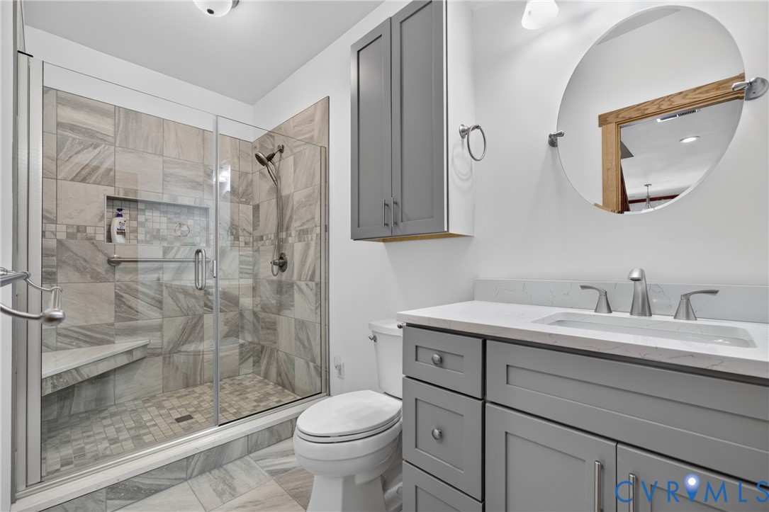 1292 Mohawk Road Long Island, VA 24569 - Photo 59 of 95 Walk-in shower with glass enclosure, built-in benc