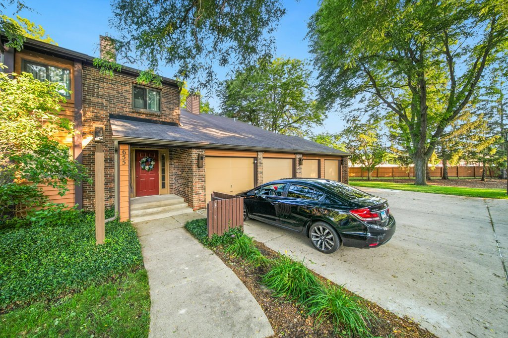 655 Waverly Drive, Unit B Elgin, IL 60120 - Photo 2 of 2 a car parked in front of a house