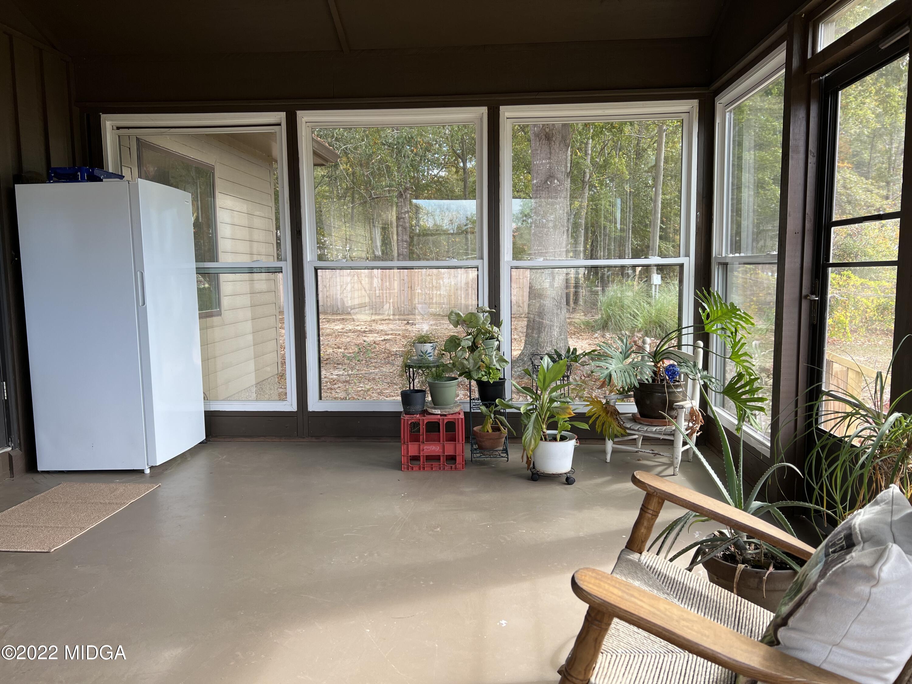 436 Barrow Road Reynolds, GA 31076 - Photo 17 of 91 a room with furniture and a potted plant