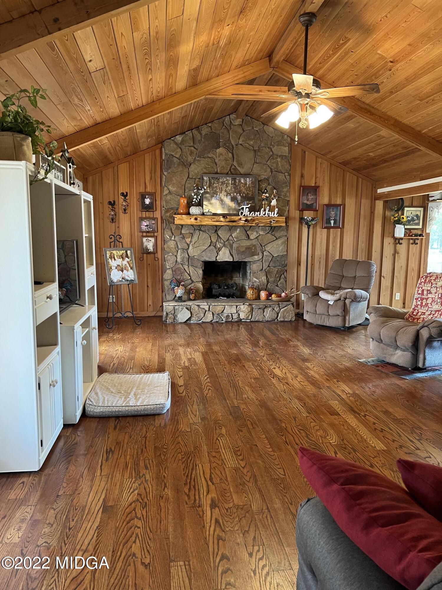 436 Barrow Road Reynolds, GA 31076 - Photo 49 of 91 a view of a room with furniture and a fireplace