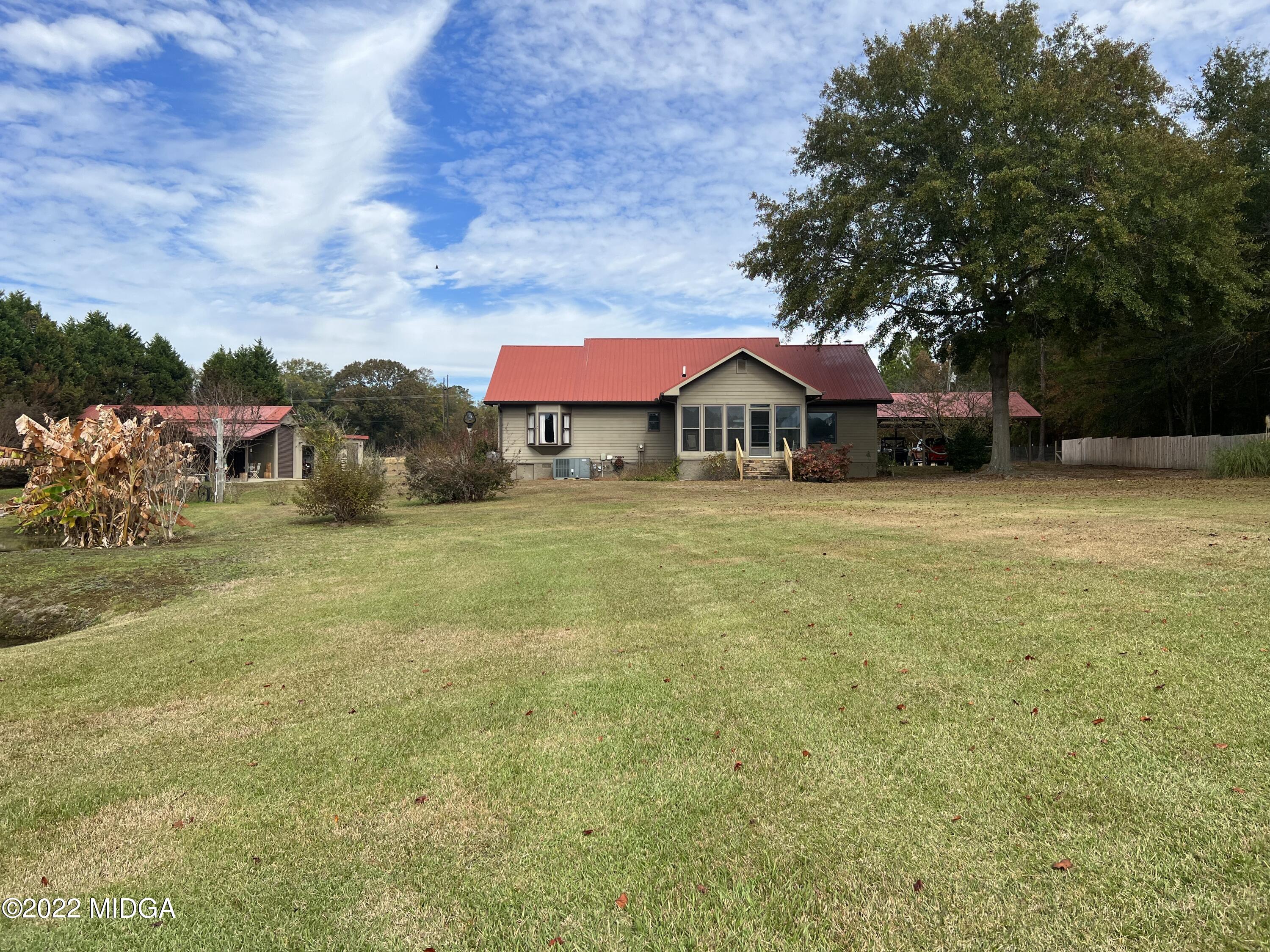 436 Barrow Road Reynolds, GA 31076 - Photo 68 of 91 a view of a house with a yard and sitting area