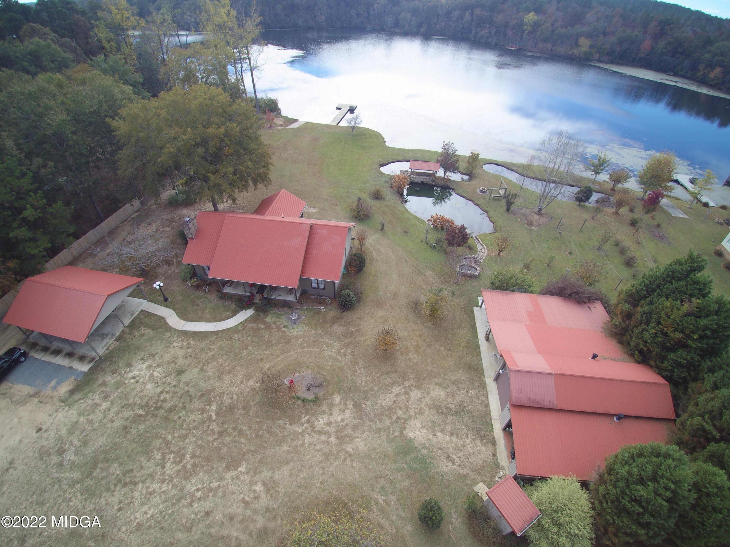 436 Barrow Road Reynolds, GA 31076 - Photo 90 of 91 an aerial view of a house with a yard
