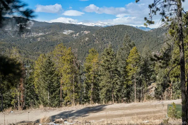 a view of a yard with mountain