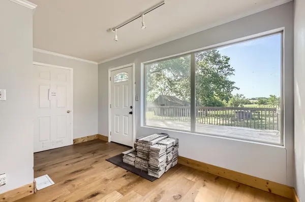 a living room with couch and a window