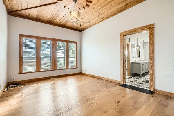 a view of an empty room with glass door