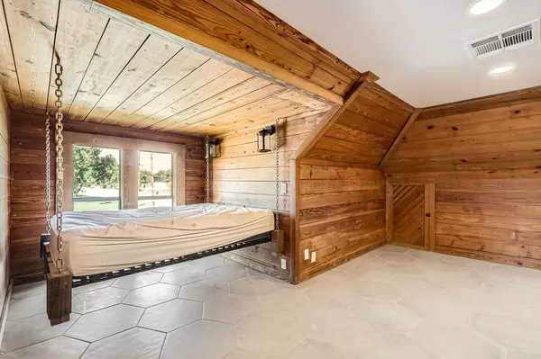 a view of a bed in a room