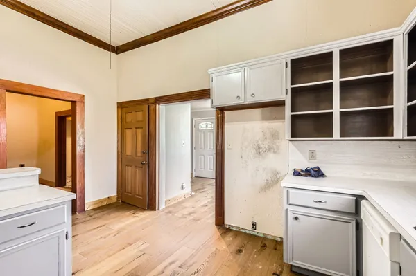 a room with a sink and a refrigerator