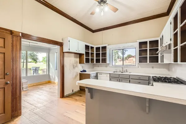 a kitchen with a sink and refrigerator