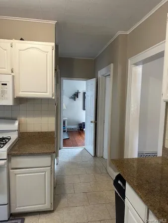 a kitchen with a refrigerator and cabinets