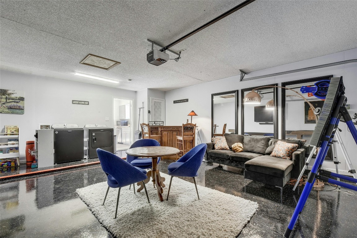 1503 Terrapin Court, Unit B Austin, TX 78746 - Photo 12 of 28 a living room with furniture a rug and a flat screen tv